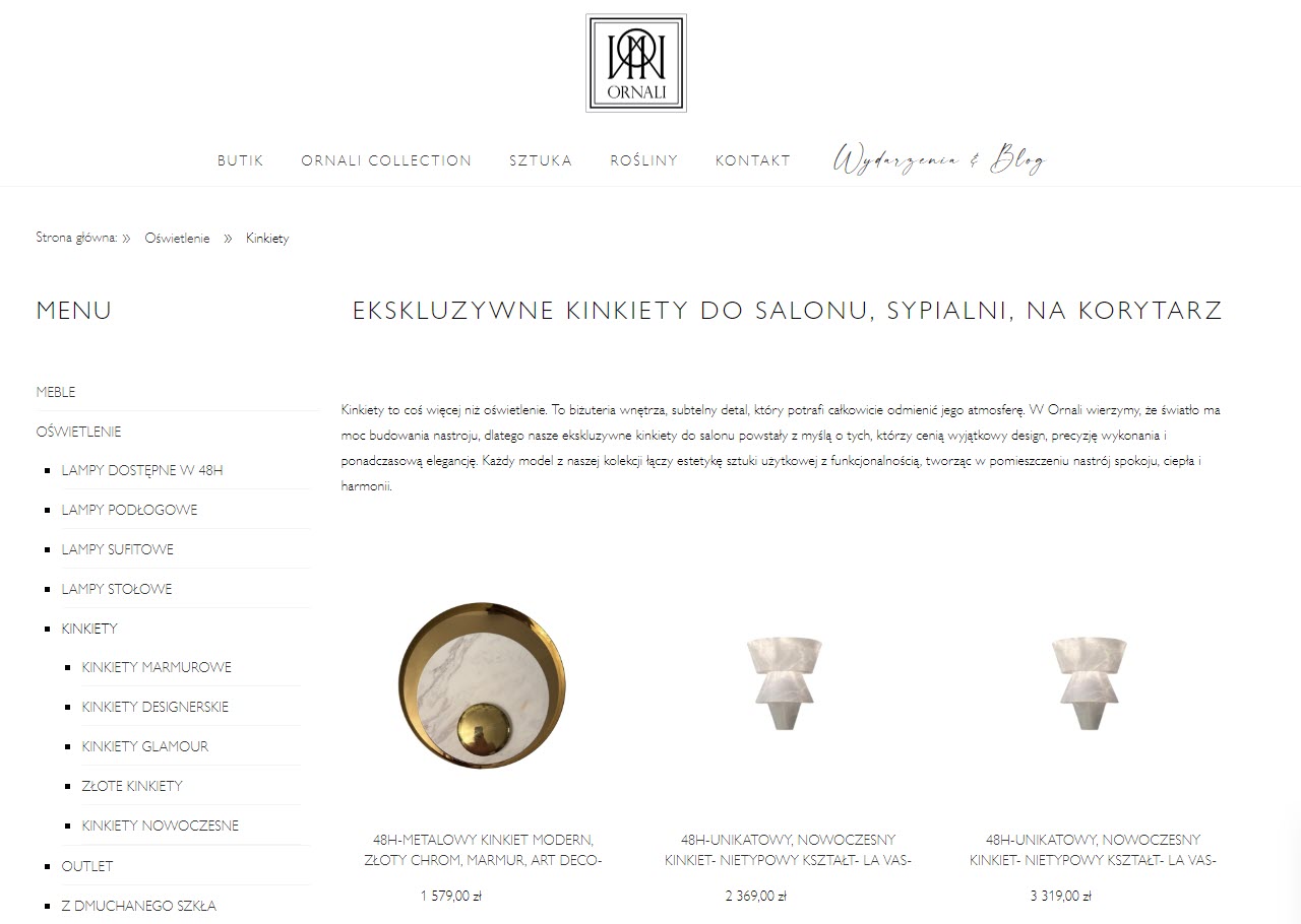 Ekskluzywne kinkiety do salonu - modne formy, kolory i materiały